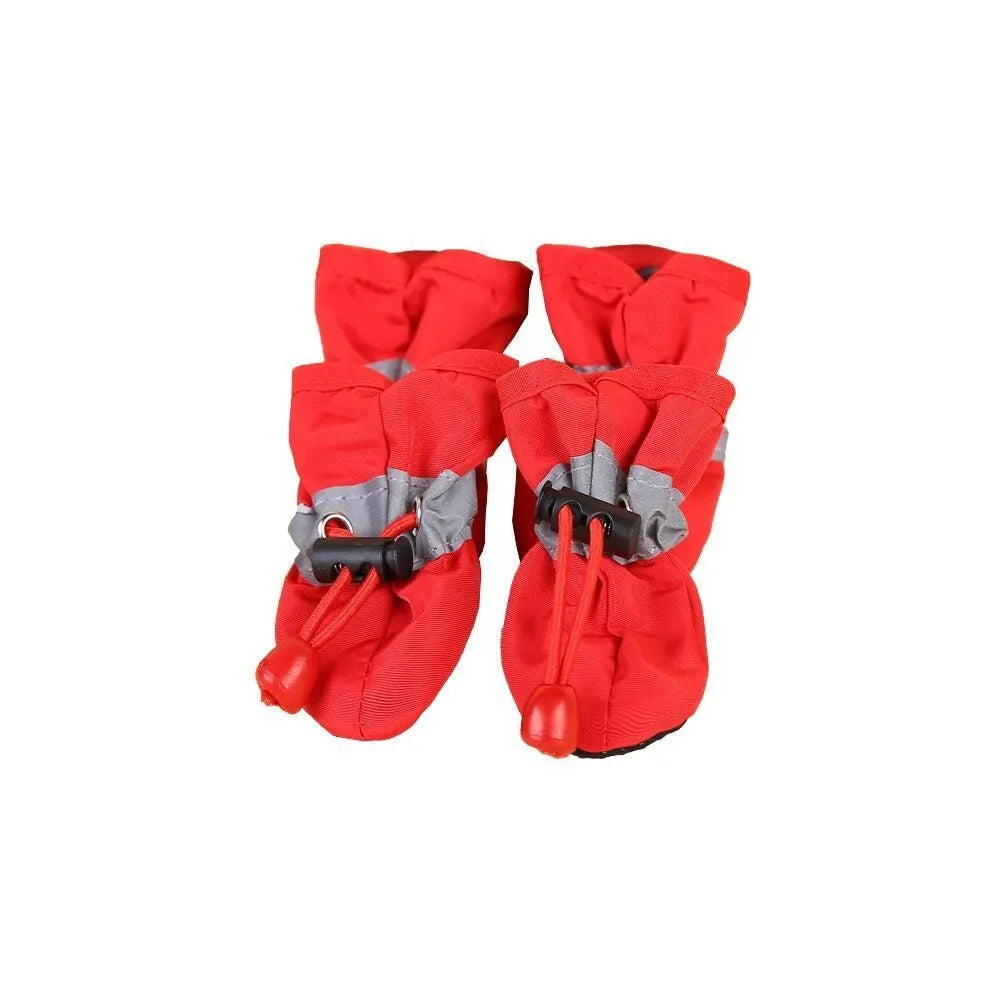 Set of four soft-soled cloth dog shoes for pets in assorted colours including red, blue, and black.