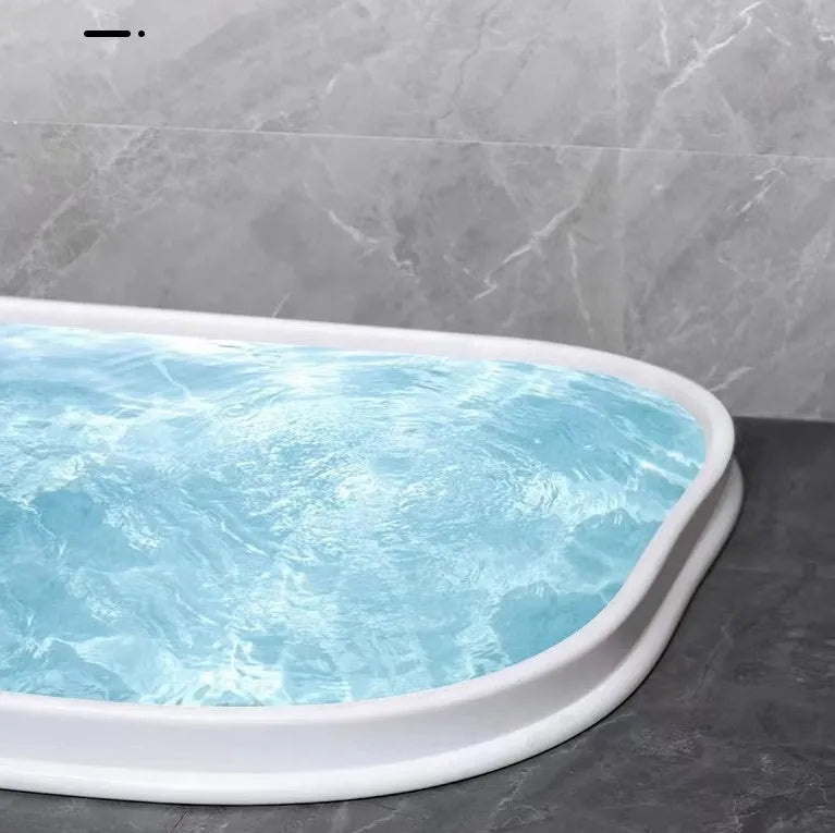 Flexible black TPE silicone water blocking strip for bathroom shower floor.