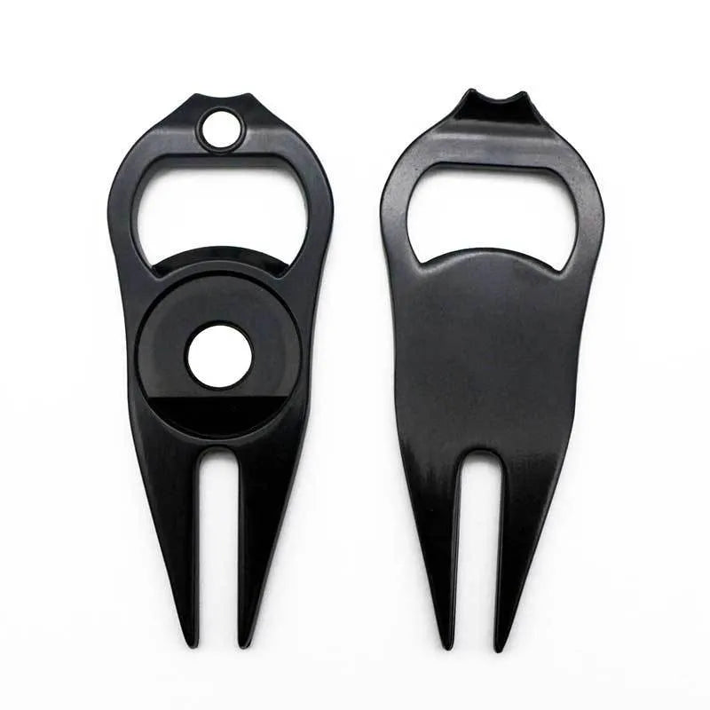 Zinc alloy golf tool with ball yoke and bottle opener, shown with a separate ball marker coin, in black, green, and silver colours.