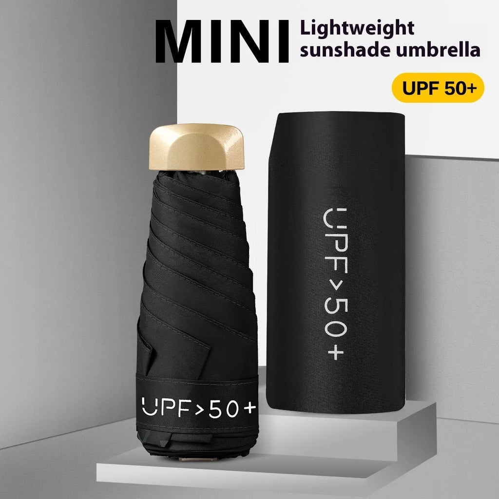 Closed five-fold compact sun umbrella with a rubber handle, shown in one of eleven available colours.