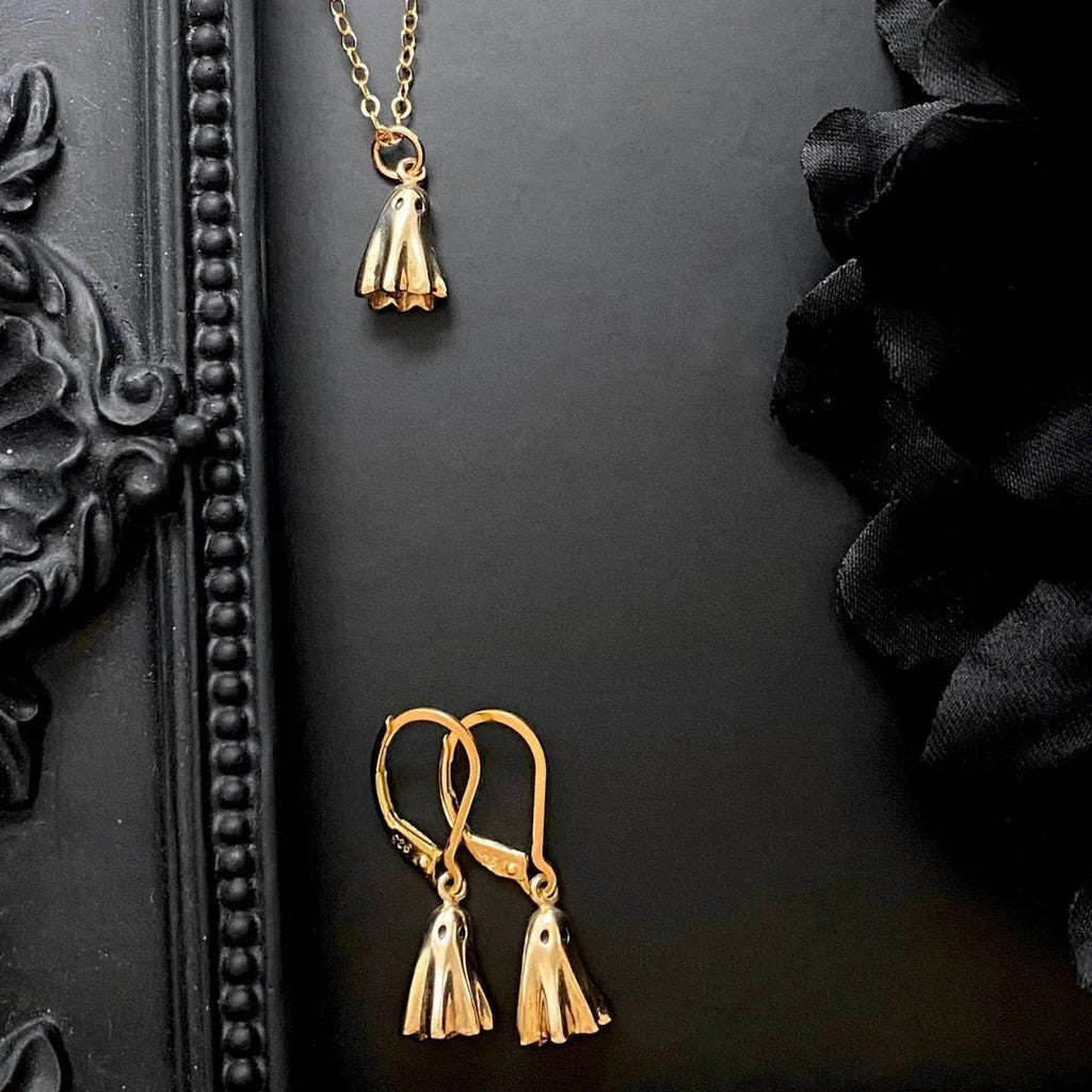 Stainless steel necklace with a detailed titanium steel ghost pendant on a twisted chain.