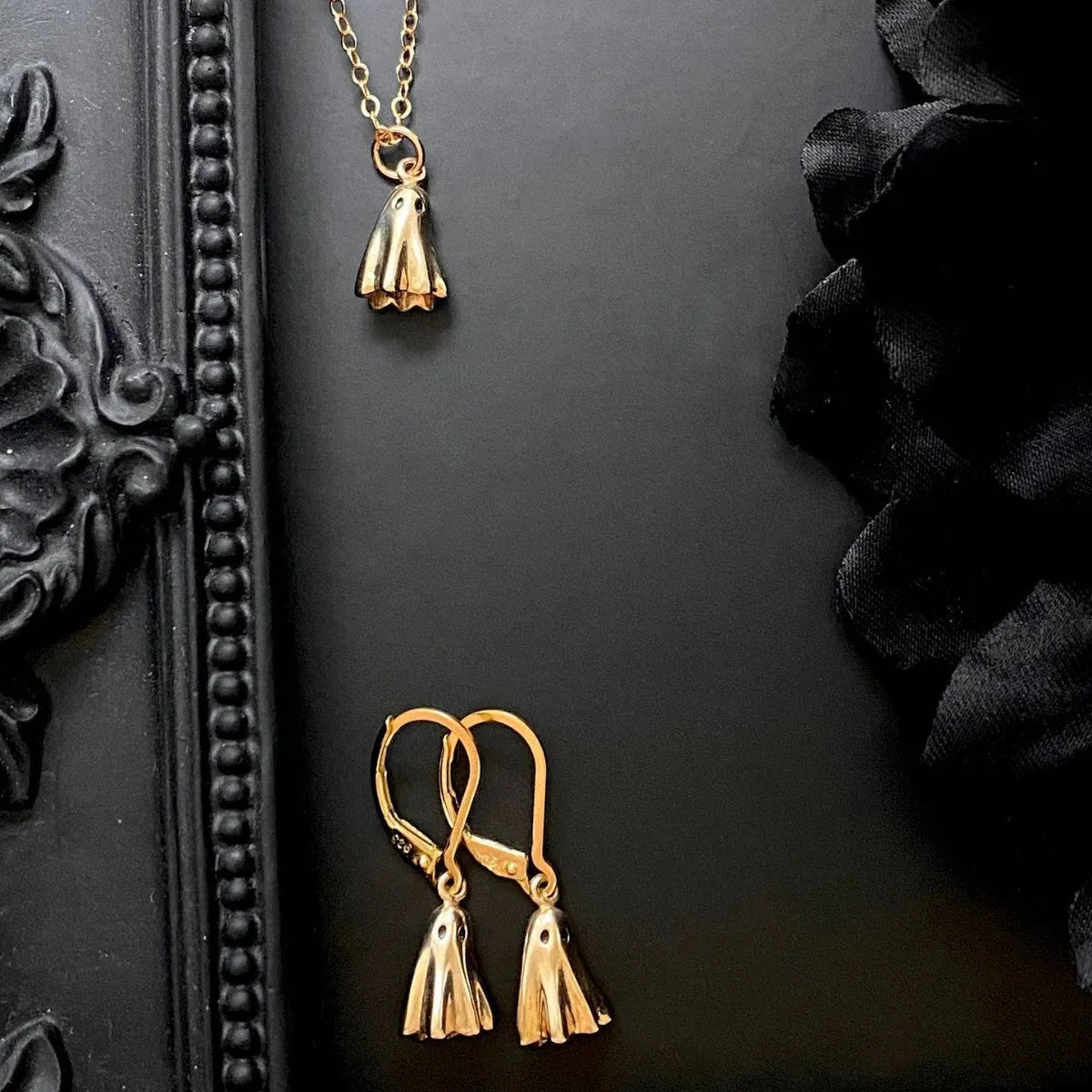 Stainless steel necklace with a detailed titanium steel ghost pendant on a twisted chain.