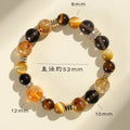 Natural yellow artificial crystal bead bracelet with 10mm tower beads on a string.