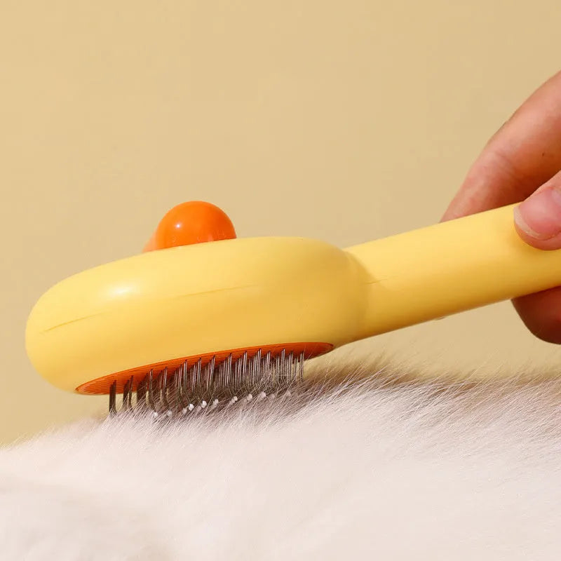 Small yellow duck comb brush for pet hair removal with open-section needle design