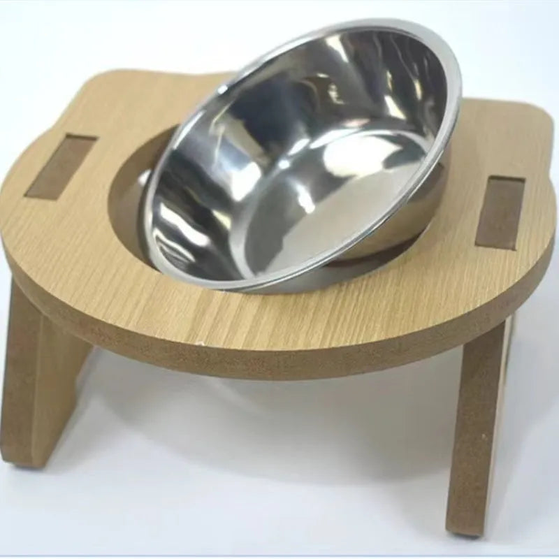 Wooden cat feeder with two stainless steel bowls for food and water on an anti-tip base.
