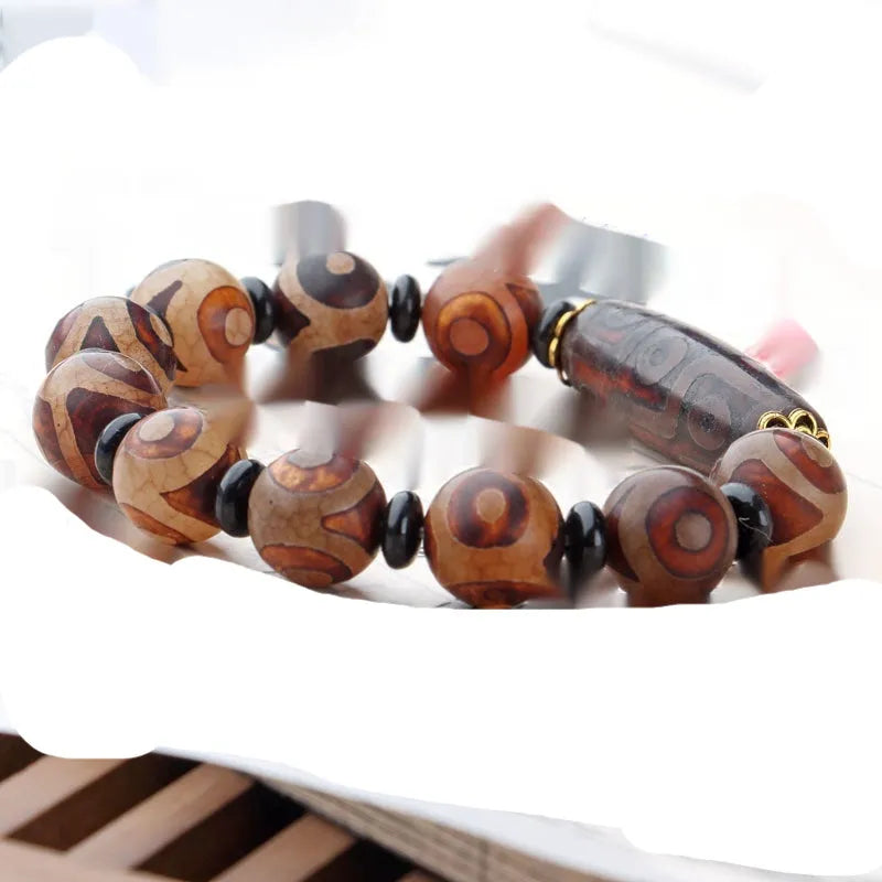 Distressed agate Tibet beads bracelet with three eye dzi design and polished stone beads