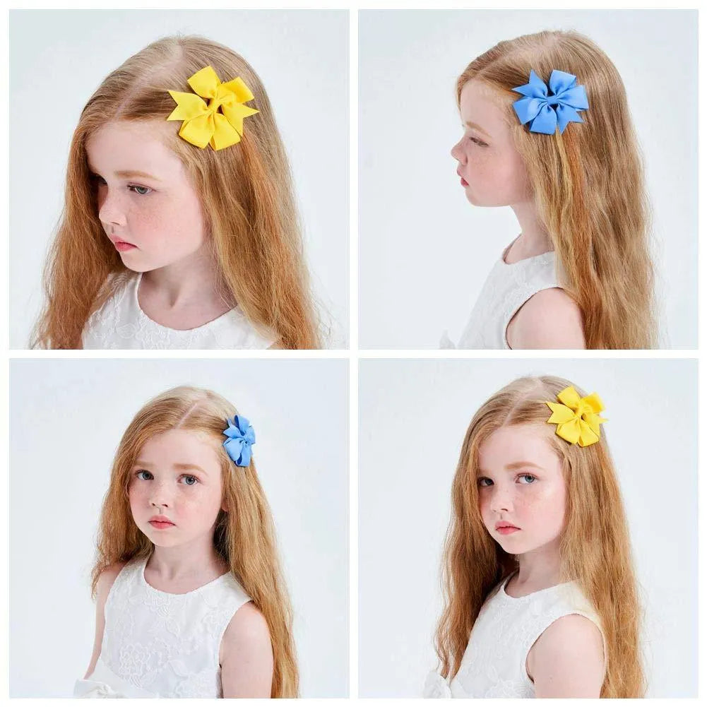 Assorted 3 inch grosgrain ribbon baby hair bows with alligator clips in multiple colours
