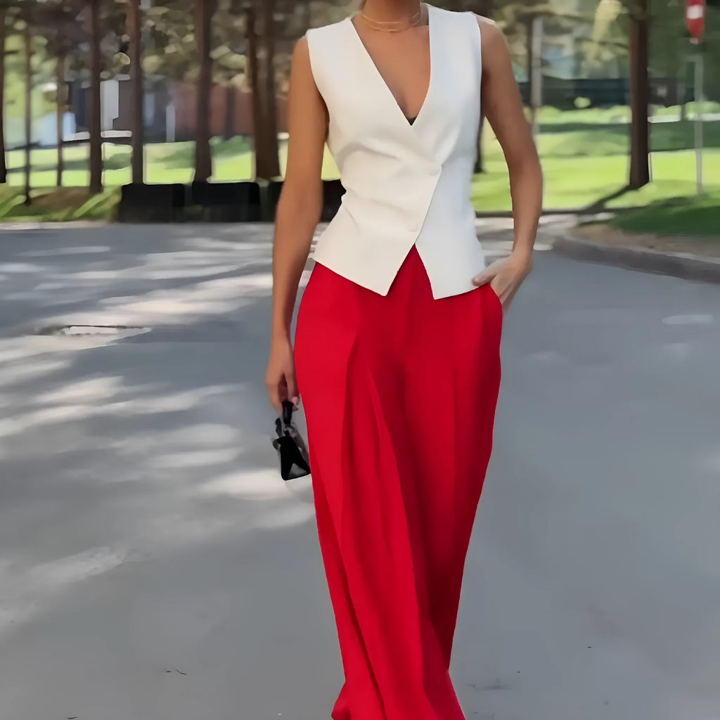 Beige women's two-piece set with sleeveless V-neck top and wide-leg trousers on a hanger.