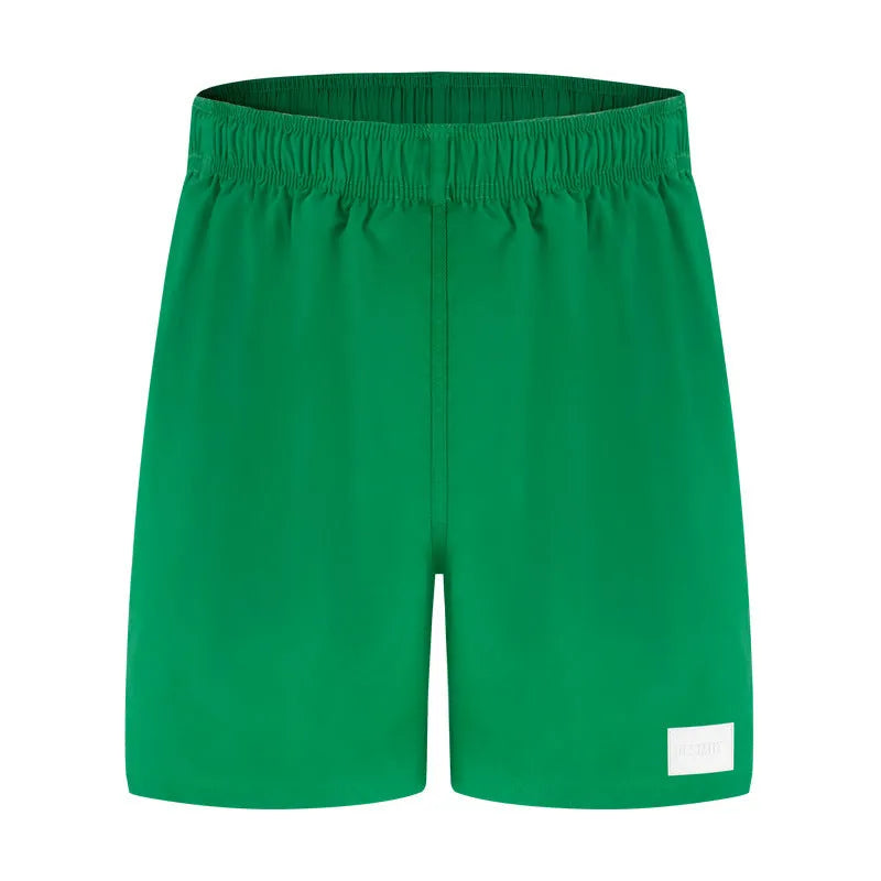 Men's solid colour quick-dry nylon beach shorts with straight leg opening