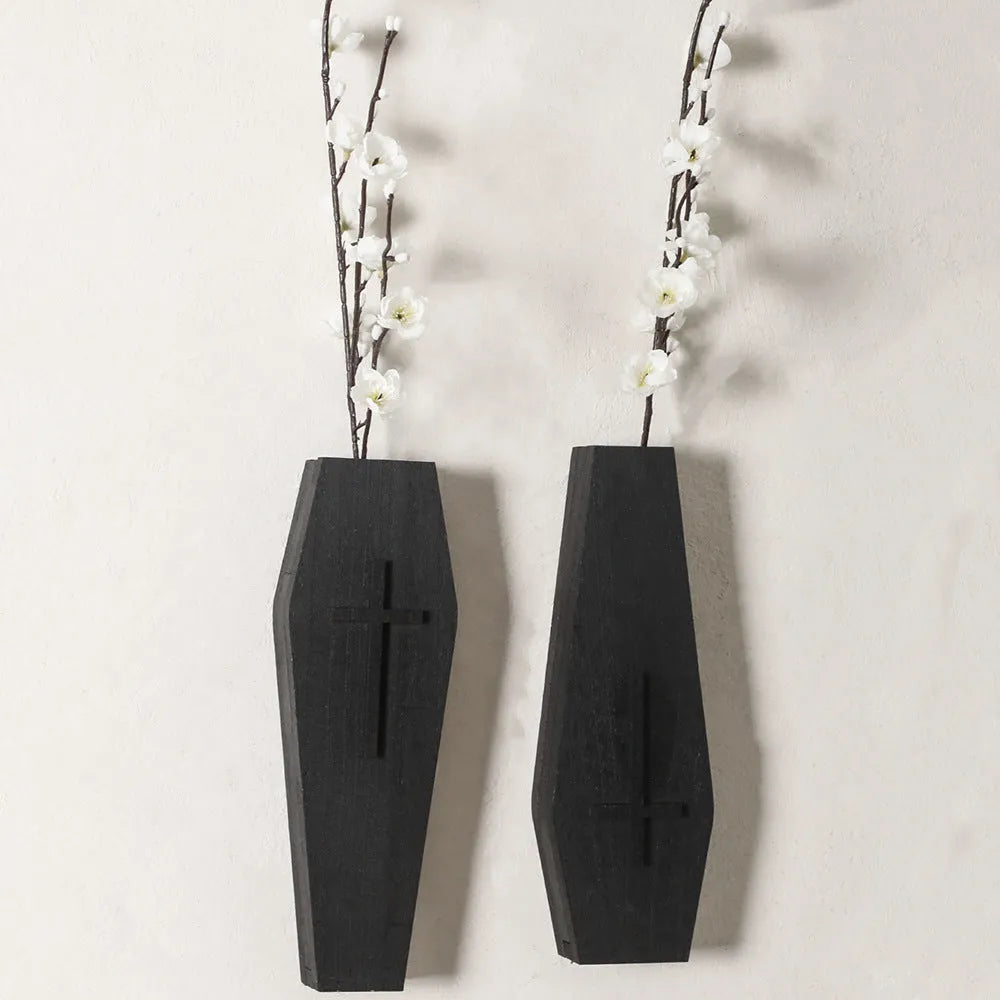 Wooden cross-shaped wall shelf decoration in black colour measuring 27 cm wide