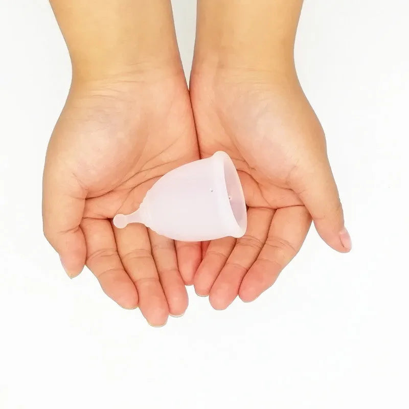 Medical grade silicone menstrual cup in black with two sizes L and S shown side by side