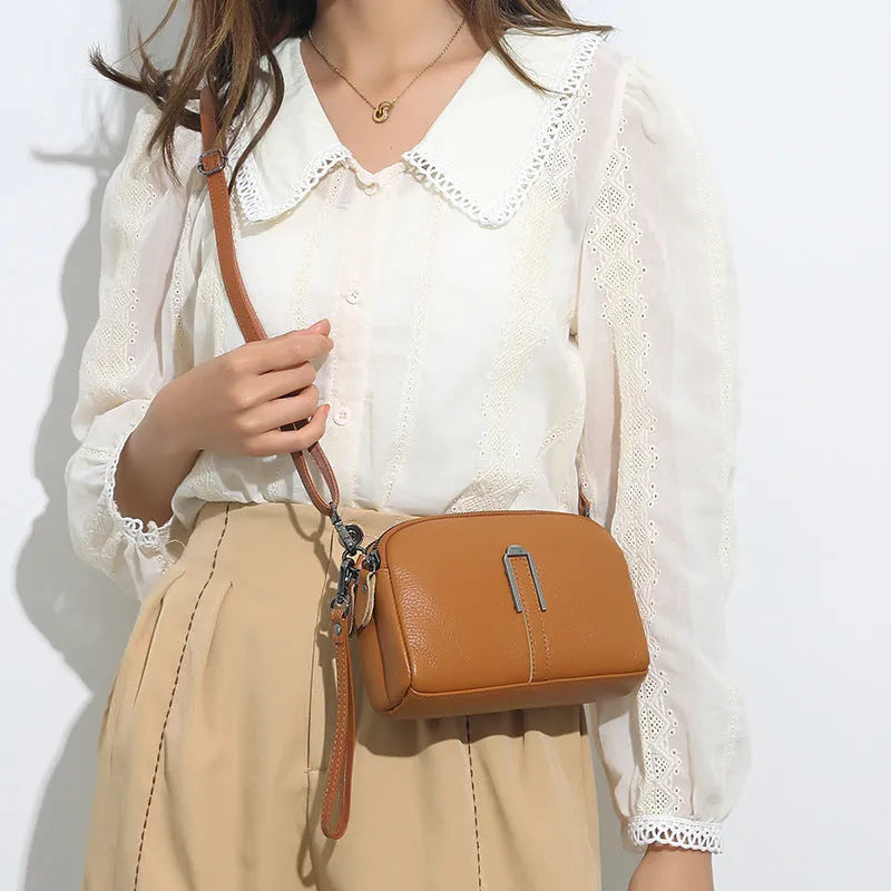 Genuine cowhide leather women's shoulder bag with horizontal square shape in dark green colour.