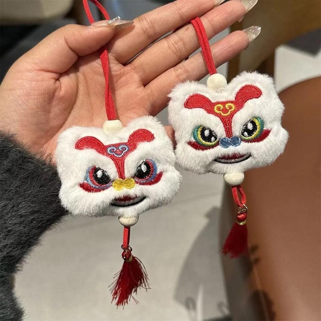 Chinese style plush lion keychain ornament with tassel and star stone accents in blue or yellow