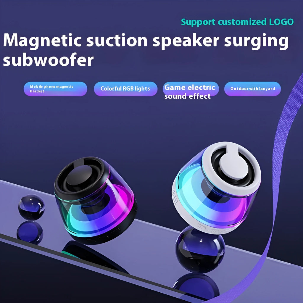 Portable white or black Bluetooth speaker with ambient lighting and magnetic design on a desktop