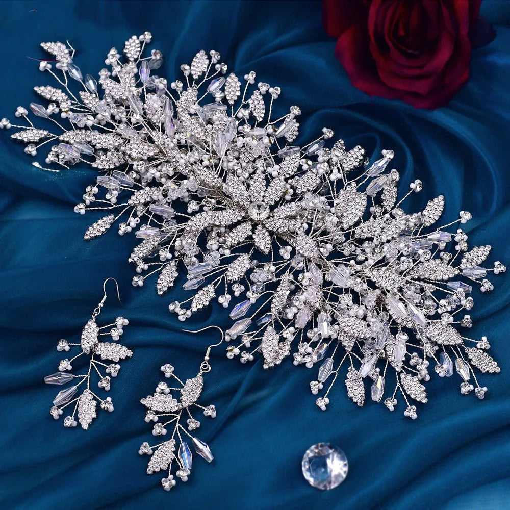 Gold rhinestone wave bridal headpiece and matching earrings set on display