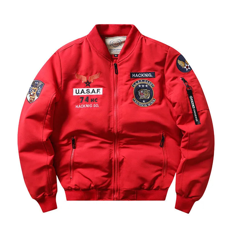 Man wearing a slim-fit black retro motorcycle jacket with stand collar and embroidery details.