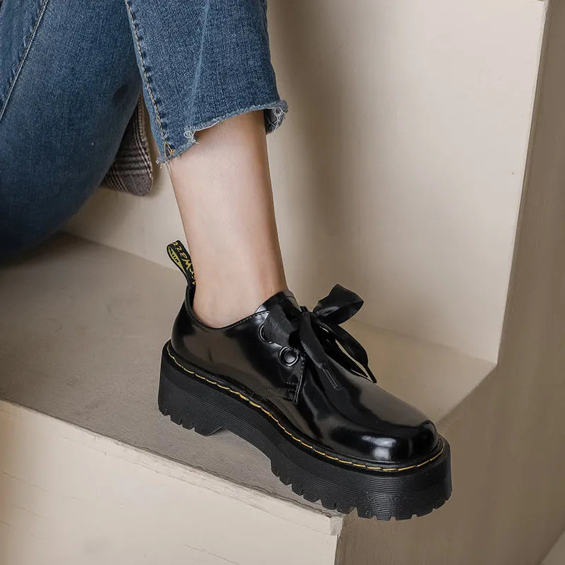 Black women's thick-soled lace-up shoes with ribbon detail on a superfine fibre upper.