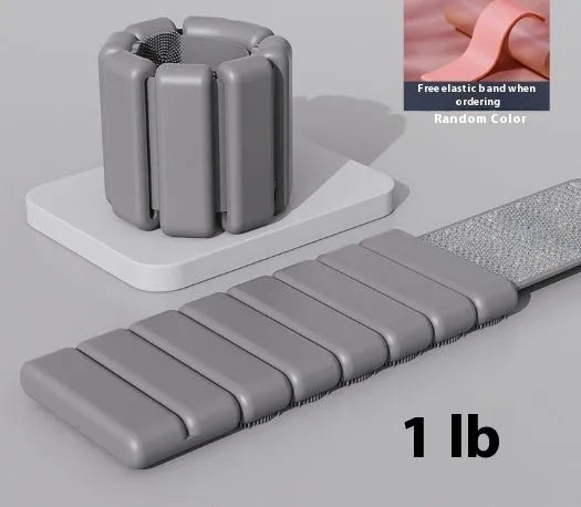 Detachable black Velcro silicone fitness bracelet with a 2lb weight on a wrist.
