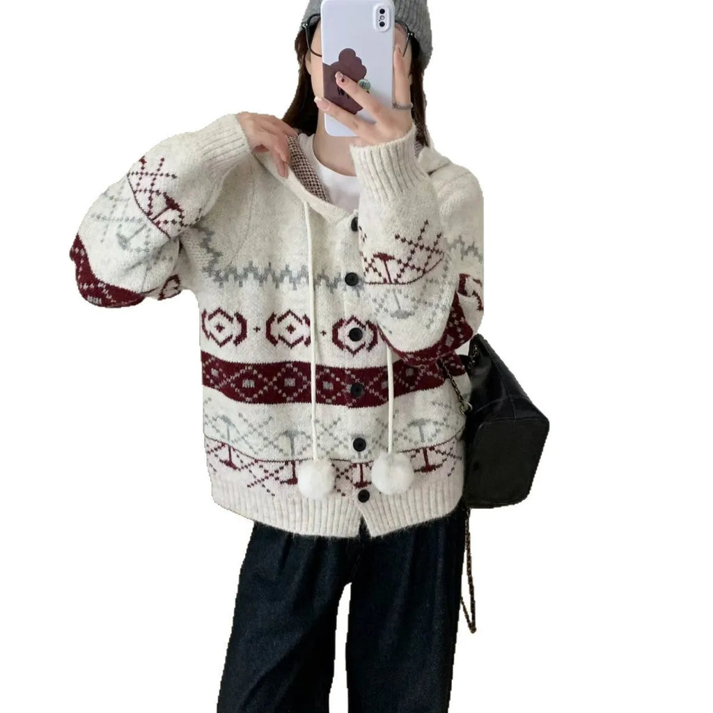 Plus size loose grey acrylic sweater coat with white geometric brocade pattern.