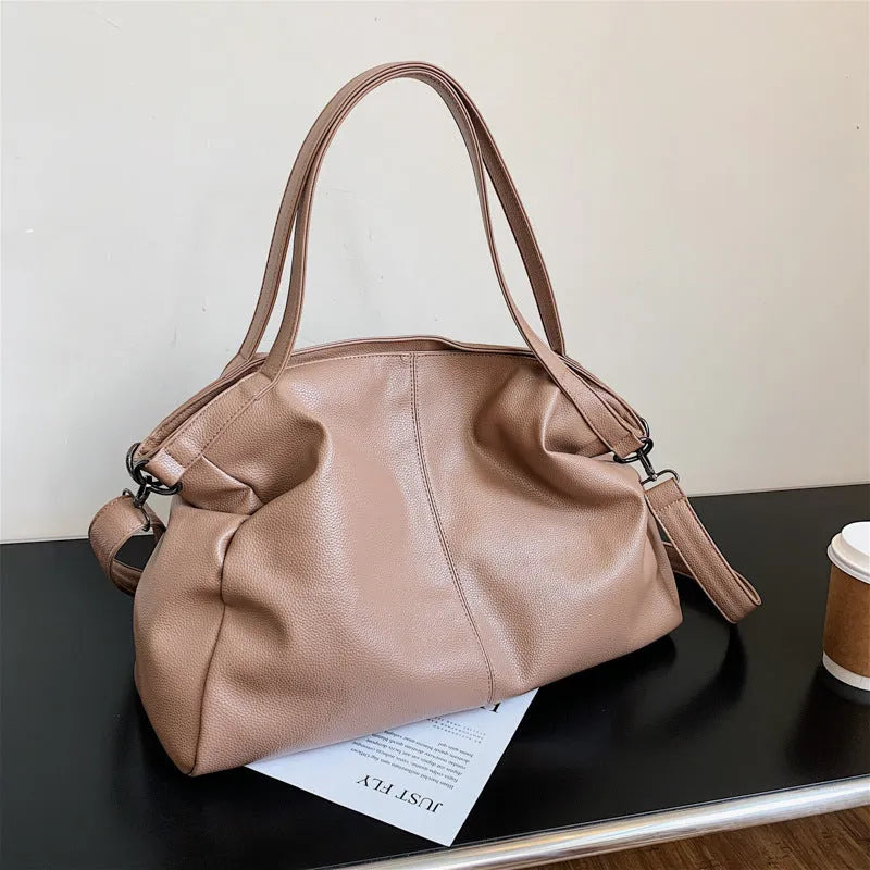 Large soft white PU messenger bag with a long cross-body shoulder strap and zip closure