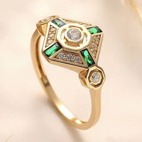 Emerald green geometric square-cut women's diamond ring with electroplated finish on a plain background.
