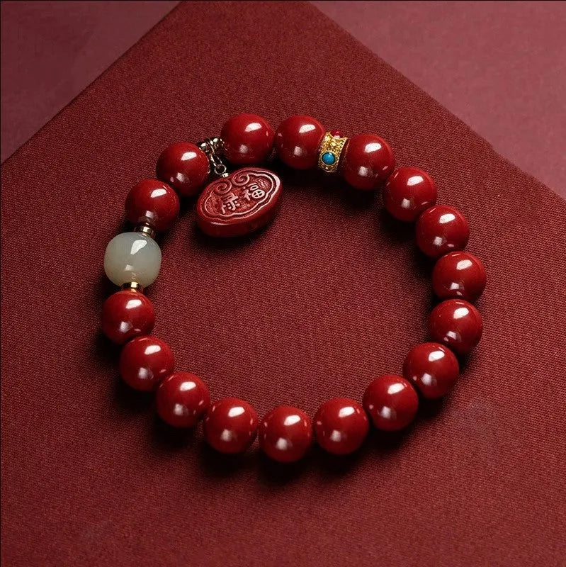 Red cinnabar bracelet with emperor sandstone carving featuring Ping An Fu Lu characters