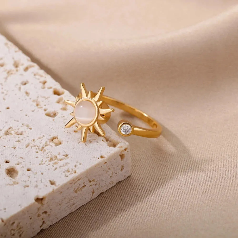 Gold and platinum coloured adjustable copper decompression ring with geometric rotatable design