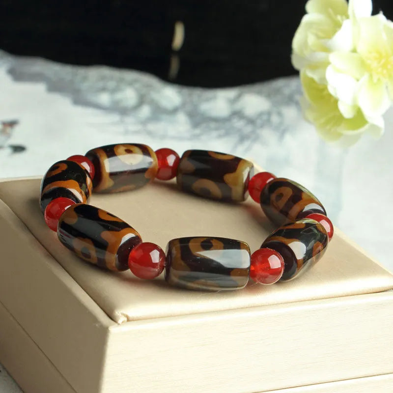 Distressed agate Tibet beads bracelet with three eye dzi design and polished stone beads