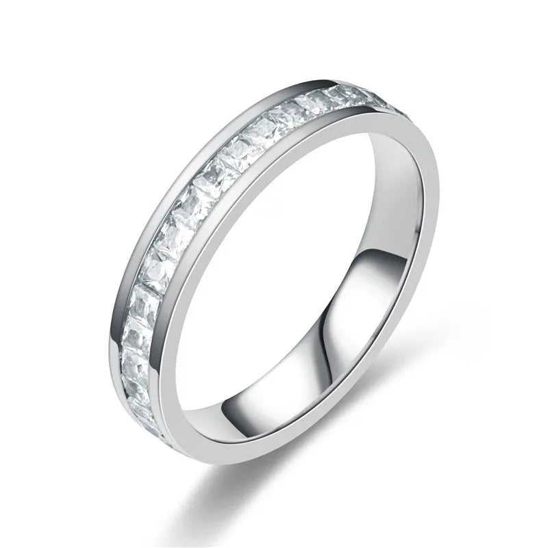Stainless steel geometric star ring with zircon inlay in gold finish on white background