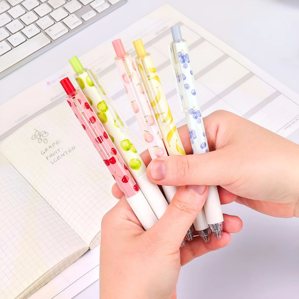 Three fruit-scented pressurised pens with 0.5mm black refills and plastic barrels