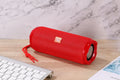 Fabric portable Bluetooth speaker with integrated card holder in one of six colour options.