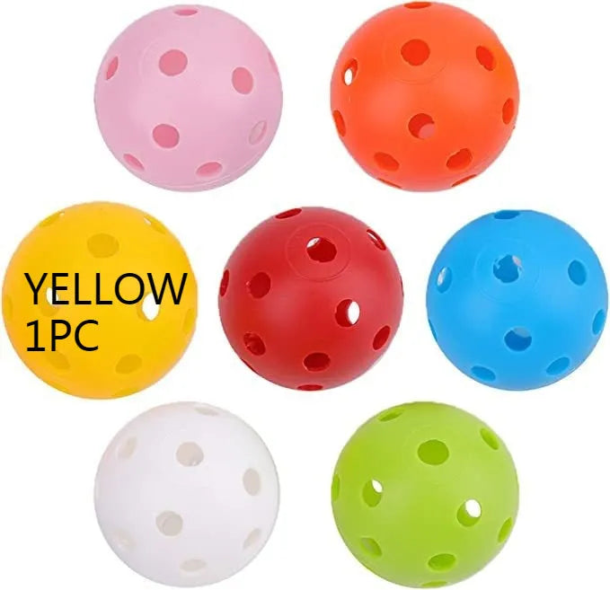 Multi-coloured golf practice balls in net storage pocket for putting training