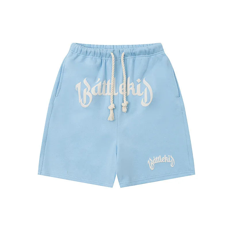 Casual cotton blend street shorts in a loose, cropped sweatpants style on a grey background.