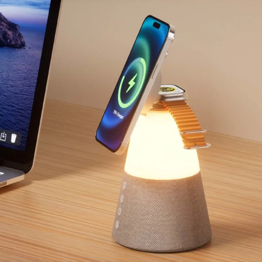 Gray 3-in-1 magnetic wireless charging Bluetooth speaker night light on a wooden table