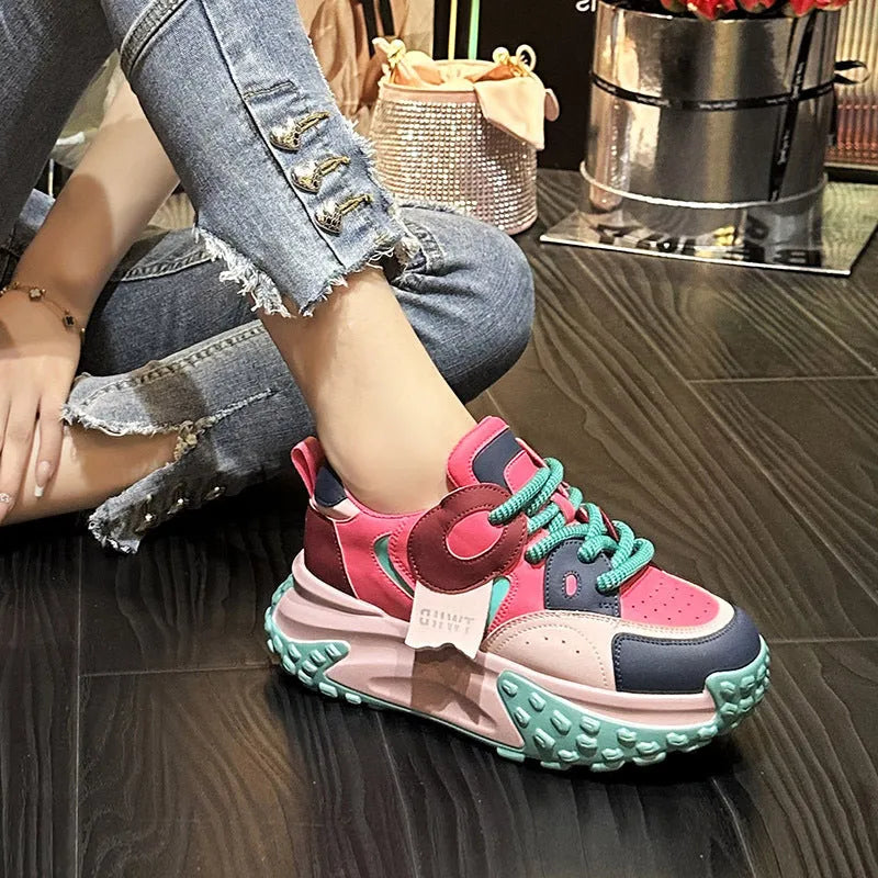 A pair of thick-soled leather sports casual shoes with a wedge heel and lace-up front in a choice of colours.