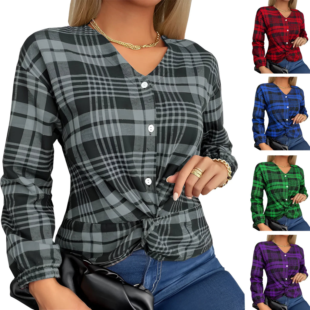 A woman wearing a loose-fitting purple plaid shirt with regular sleeves.