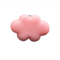 Small colourful resin car fragrance clip shown in multiple colours on a car air vent.