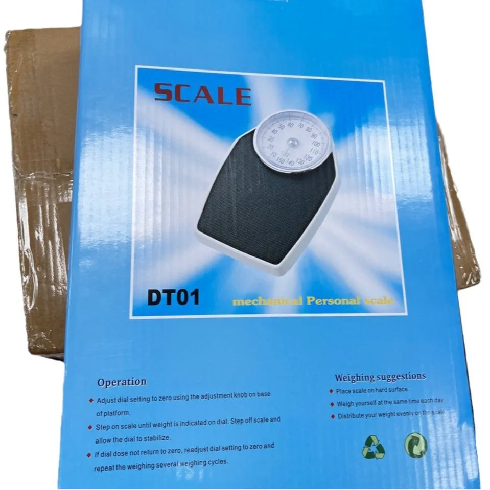 Black mechanical bathroom scale with large dial on a 47x35 cm platform.