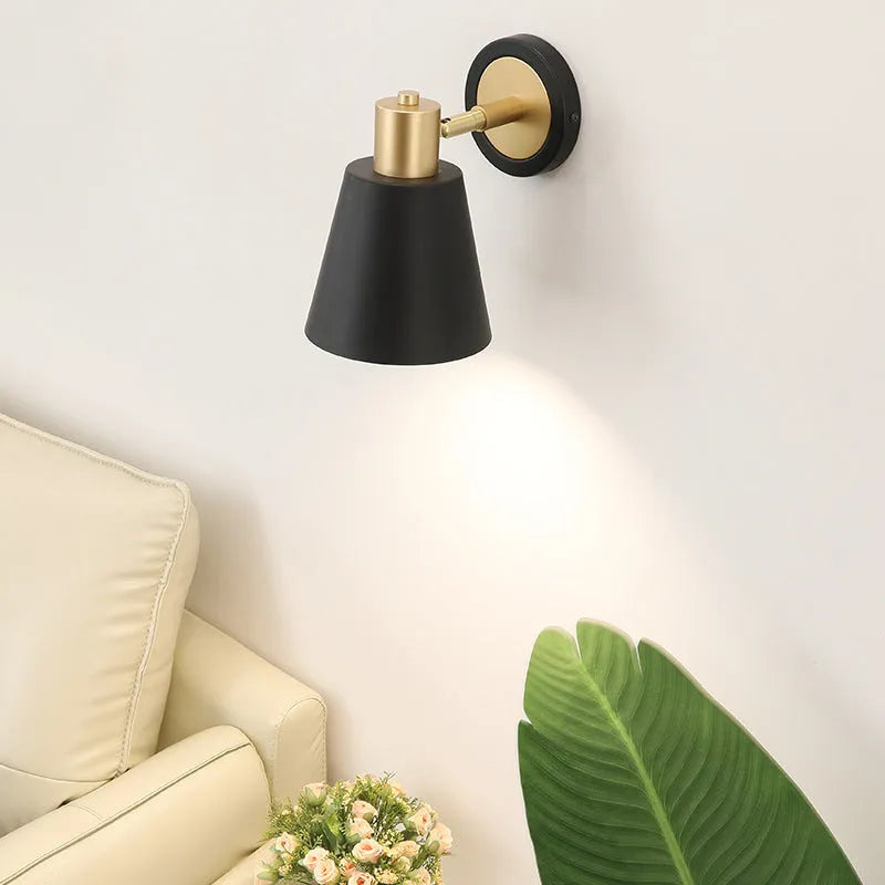 Black iron Nordic-style wall lamp mounted beside a bed with four different shade design options.