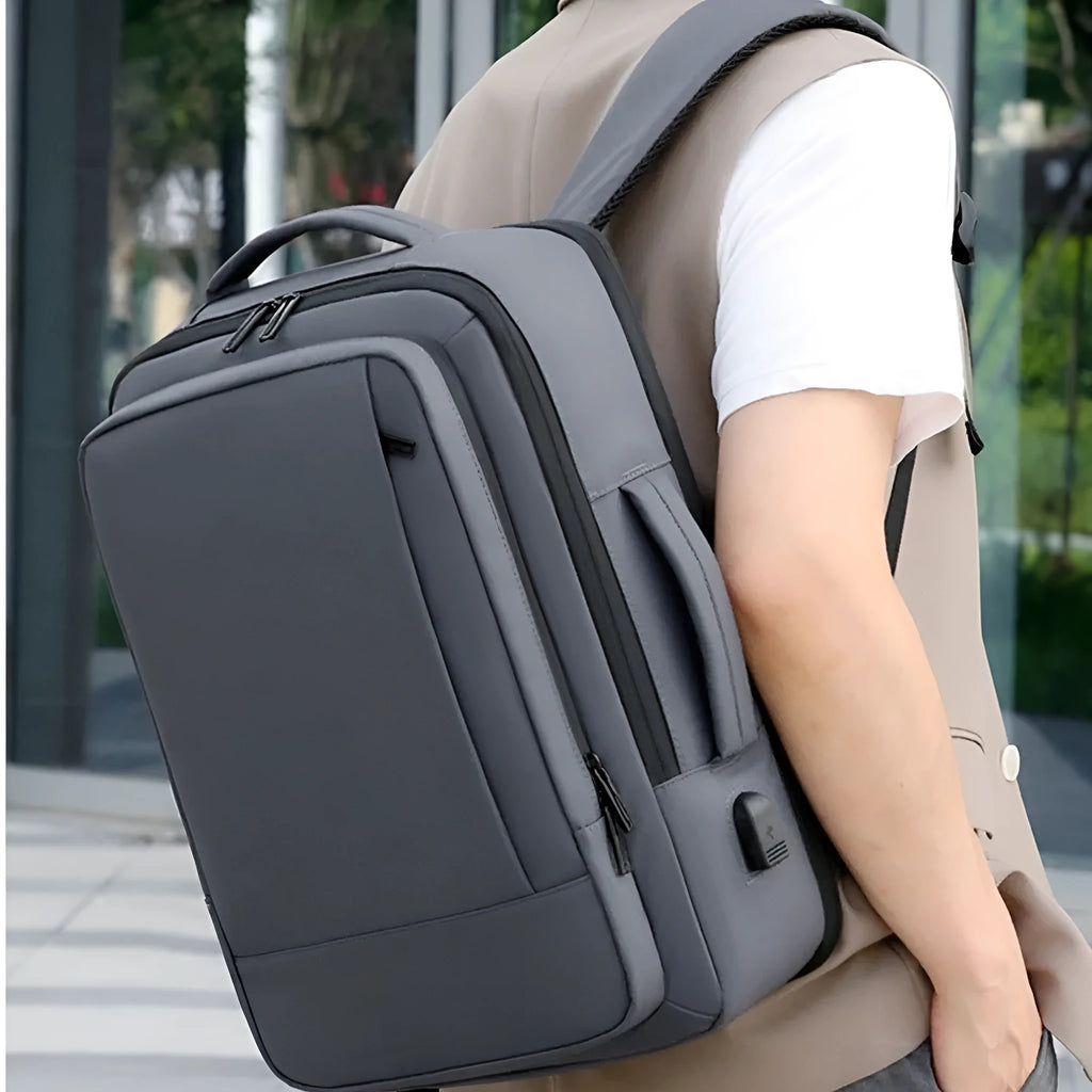 Black waterproof Oxford cloth backpack with curved shoulder straps showing business style and 20-35L capacity