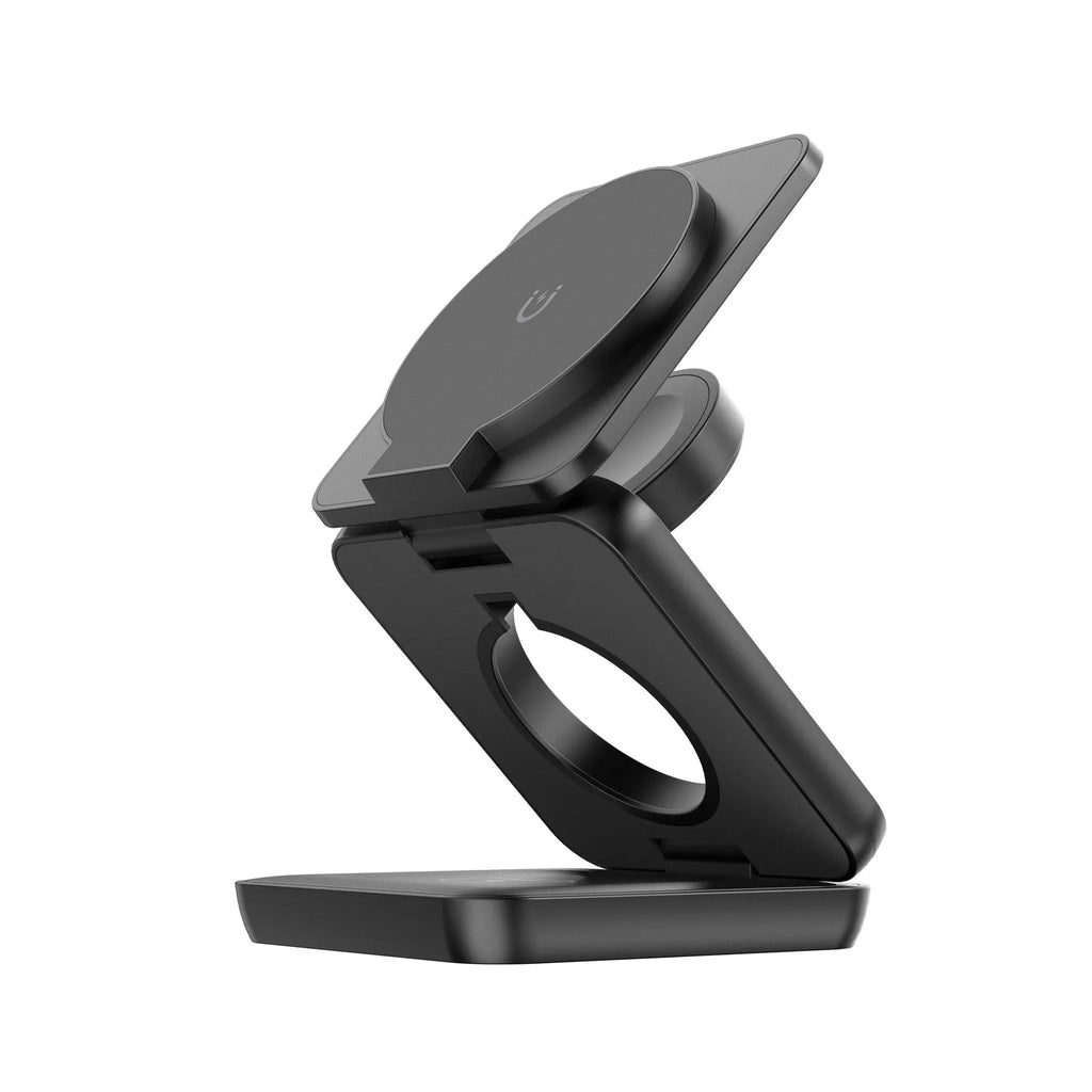 White foldable magnetic wireless phone charger holder in open position on a desk
