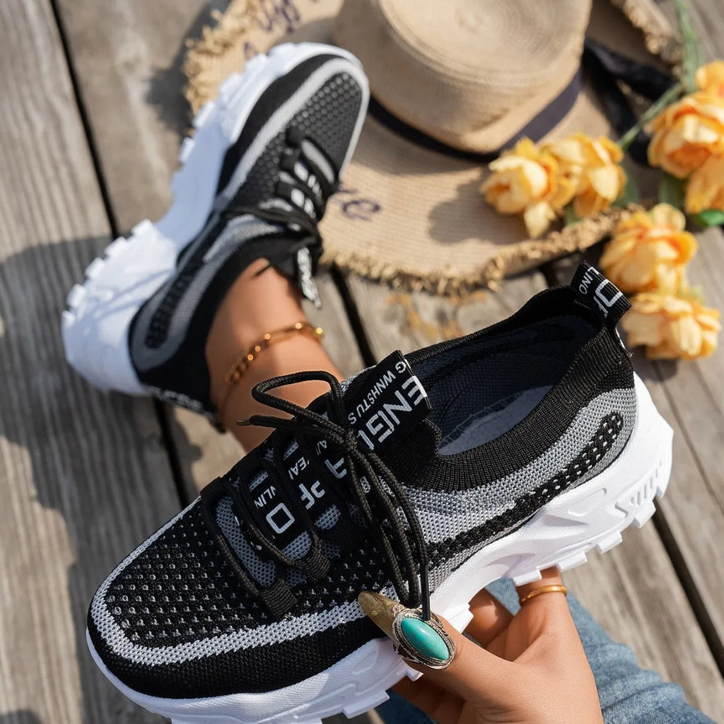 Women's Flyknit mesh lace-up sneakers in grey colour with low rubber sole