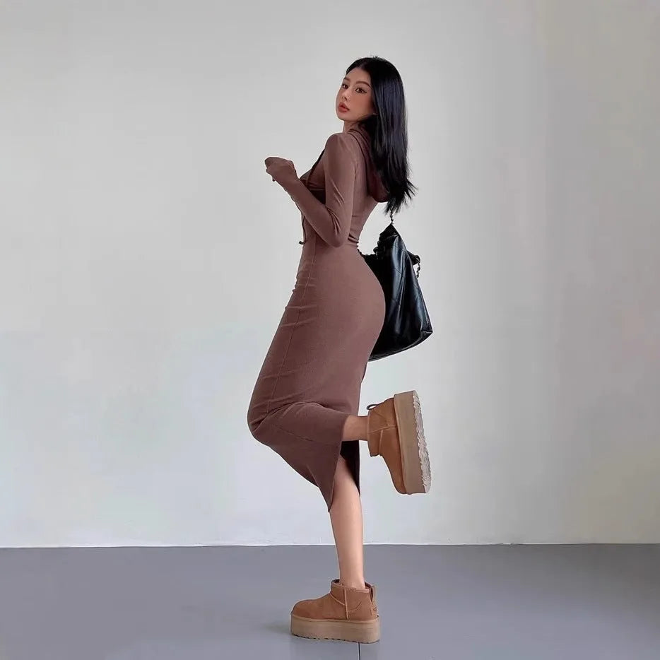 Women's long hooded dress with long sleeves and a sheath silhouette in polyester.