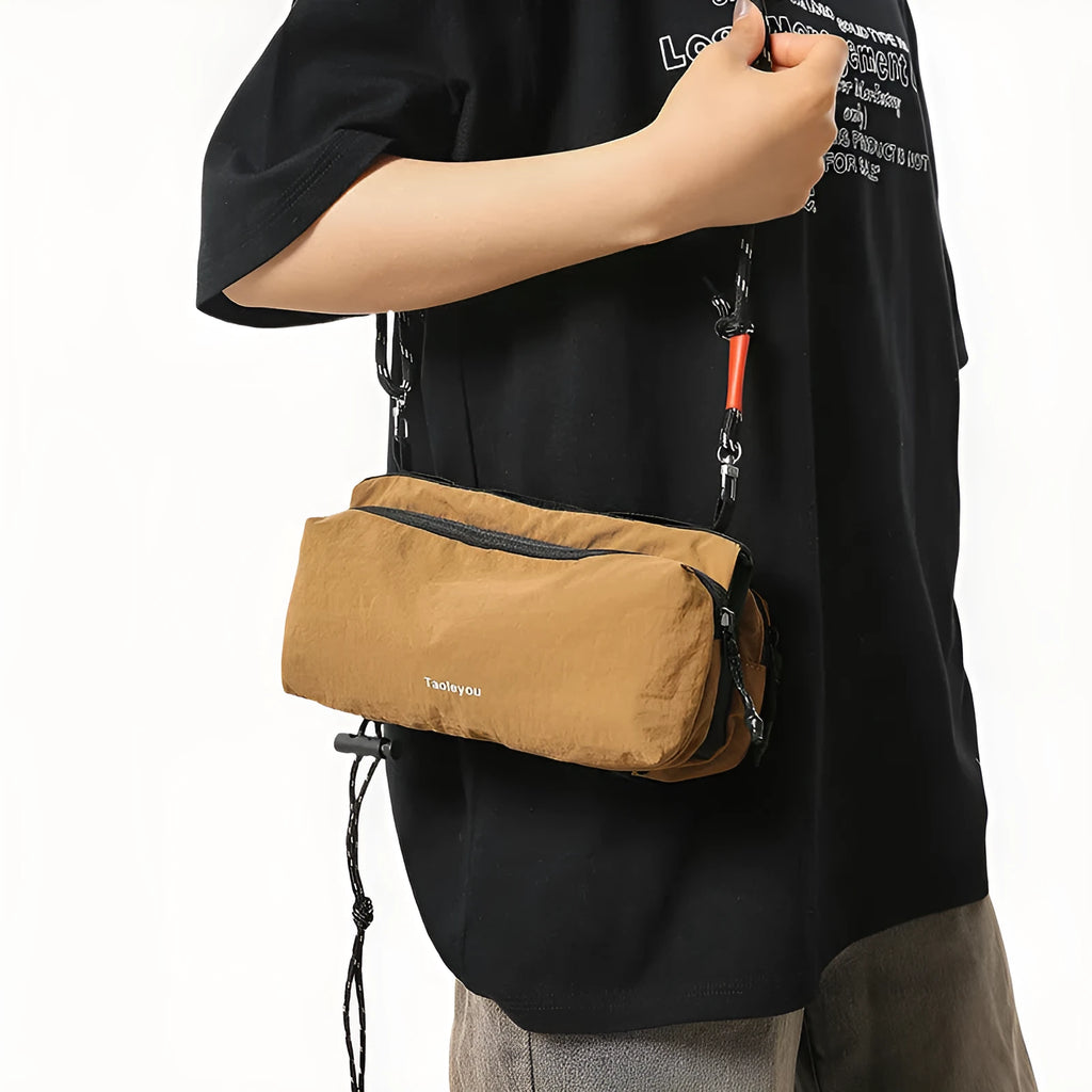 Women's sports crossbody bag nylon pillow shape 22cm length 4cm width 9cm height stitching black