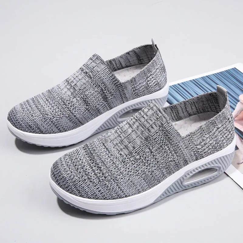 Women's mesh running shoes with air cushion in multiple colours showing round toe and mid-heel design
