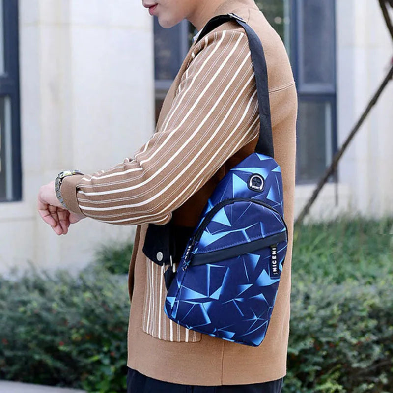 Blue Oxford cloth sling bag with a crossbody strap, earphone hole, and zipper pocket.