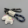 Handmade brown cowhide key ring pendant with a zinc alloy pony belt buckle and green flanelle rope.