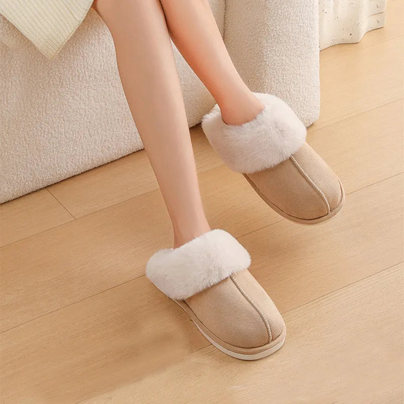 Women's plush winter slippers in grey with a round toe, flat heel, and non-slip PVC sole.