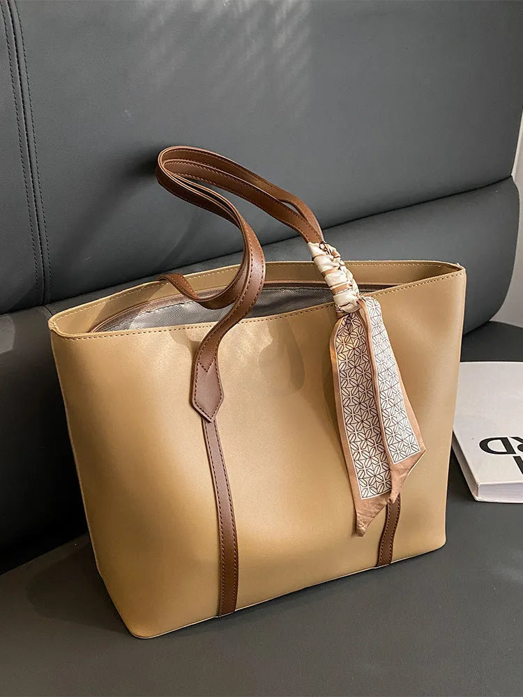 Large capacity bucket style tote bag with crossbody strap in multiple colour options