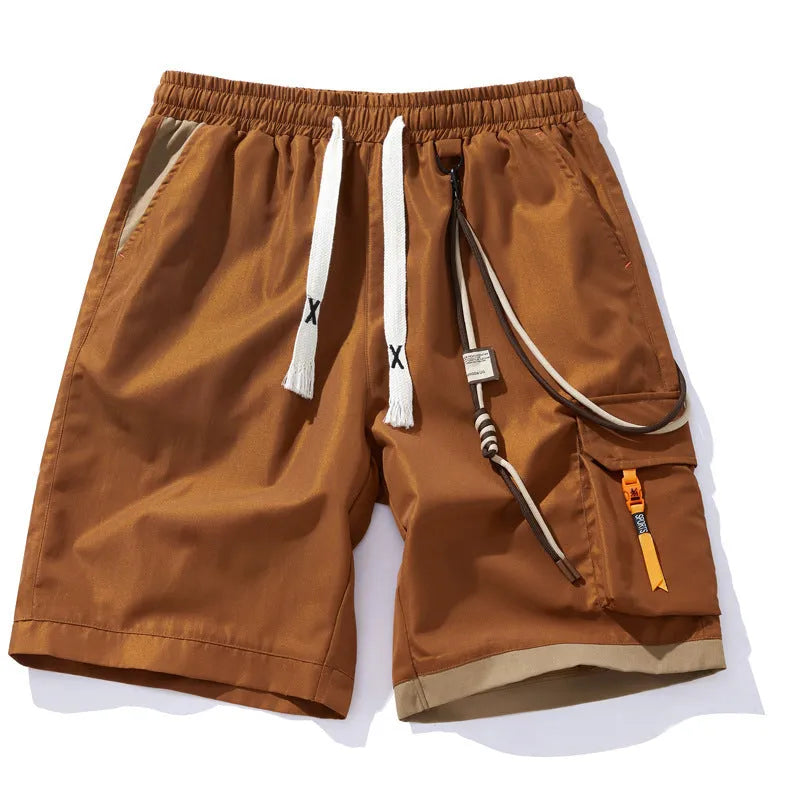 Man wearing coffee-coloured high-waisted bamboo fibre plus-size sports shorts with a loose, straight-leg fit.
